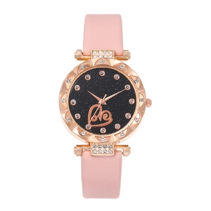 Detail of rose gold diamond-set bezel and starry sky dial with love heart design