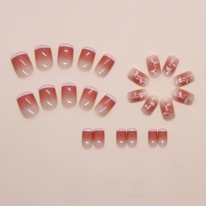 Detailed set of 24 French tip press-on nails with pink blush gradient and cloud patterns