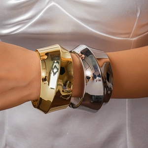 Minimalist wide metal open bracelets in polished gold and silver finish set on model