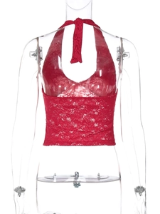 Close-up of red lace halter top showing detailed hollow-out patterns and tie neck