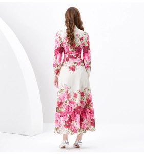 Close-up of red floral print on long sleeve vacation maxi dress with A-line cut