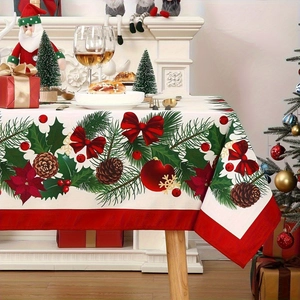 Christmas tablecloth detail with pine cones berries and ornaments on a wooden table