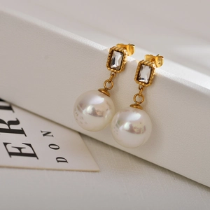 Vintage pearl drop earrings with gold square studs and sparkling zircon in a luxury style