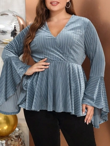 Women's plus size deep V-neck top in metallic blue fabric with flared sleeves