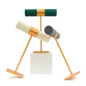 Three-tier jewelry display stands with microfiber crossbars and golden metal frames