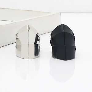 Detail of knight armor style rings in polished silver and matte black finish