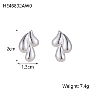 Macro shot of silver teardrop stud earrings with layered design and size measurements