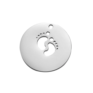 Detail of round silver pendant with hollow baby footprints and polished finish
