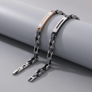 Industrial stainless steel bracelets in rose gold and silver finish on display stand