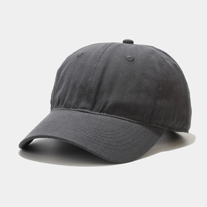 Detailed close-up of charcoal grey cotton baseball cap with ventilation eyelets