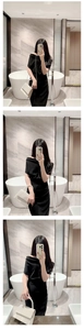 Elegant white satin evening clutch with pearl handle held by a model in a black dress