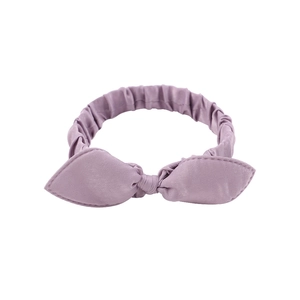 Detailed view of lavender cotton bow headband featuring elastic pleated fabric for infants