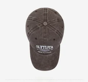 Top-down view of washed charcoal cotton baseball cap with white athletic embroidery