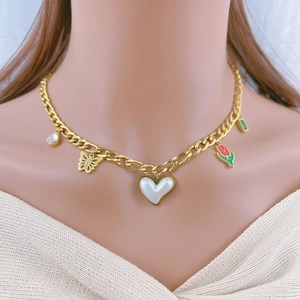 Golden chain necklace featuring pearl heart, butterfly, tulip, and emerald-cut stone charms
