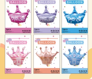 Detail view of multi-color crown aluminum foil balloons for princess birthday parties