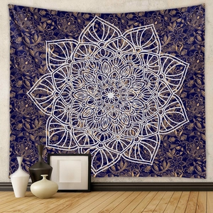 Close-up of bohemian mandala tapestry featuring golden paisley patterns on dark blue fabric