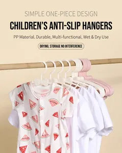 Detail of pink bow-shaped non-slip baby hanger with a watermelon print infant romper