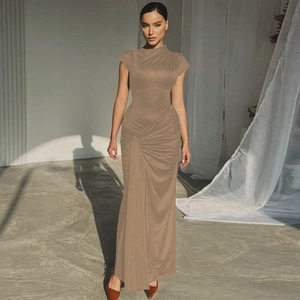 Detail of elegant taupe slim-fit dress with ruched texture and silky elastic fabric