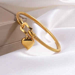 Golden titanium heart pendant bracelet with steel cable band and I love you engraving