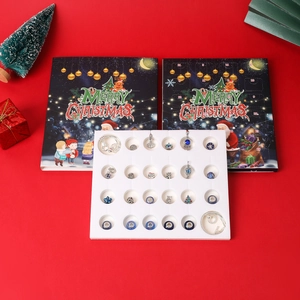 Blue Christmas advent calendar set with silver beads and bracelets on red background