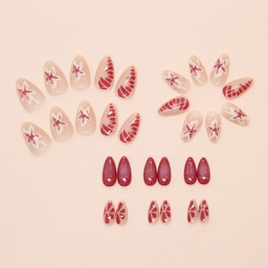 Faux ongles amande avec motifs floraux 3D et texture goutte d'eau en rouge et blanc