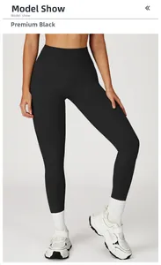 Leggings de yoga sans couture à taille haute en noir premium sur un mannequin de fitness