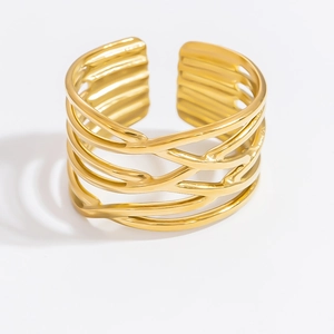 Detailed close-up of a wide hollow interwoven gold ring with a minimalist geometric design