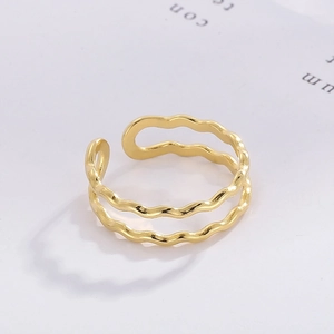 Close-up of golden double-layer wavy open ring with adjustable minimalist design