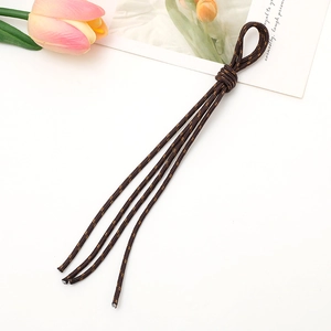 Detailed view of a brown braided phone lanyard with aesthetic tulip and postcard decor