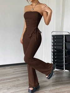 Women's 2-piece set with dark brown tube top and high waist flared trousers outfit
