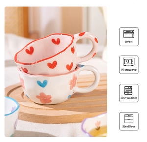 Detail of irregular ceramic mugs with hand-painted patterns showing dishwasher and oven safety