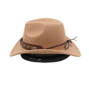 Detail of camel western cowboy hat featuring brown leather belt and star metal studs