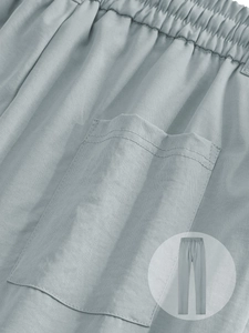 Détails du pantalon gris pour homme montrant la taille élastique et les coutures de poche