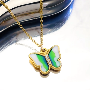 Elegant gold butterfly pendant necklace with gradient wings and sparkling diamond accents