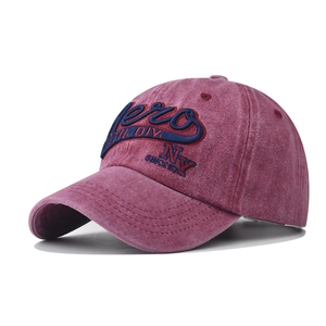 Detailed view of vintage washed burgundy baseball cap with 3D embroidery and stitching