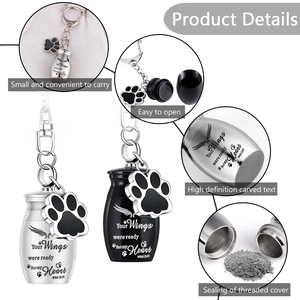 Pet memorial cremation urn keychain with paw pendant and engraved tribute in silver and black
