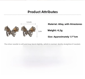 Detailed view of silver butterfly stud earrings with rhinestones and size specifications
