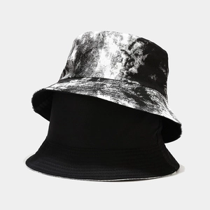 Reversible tie-dye bucket hat in black and white splash ink print for outdoor sun protection