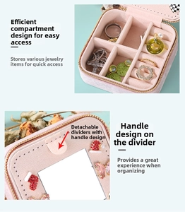 Pink velvet jewelry box detail showing detachable dividers and mirror for accessories