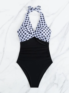 Flat lay of halter neck one-piece swimsuit with gingham pattern and waist ruching detail