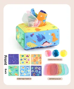 Infant sensory tissue box toy featuring dinosaur prints, plush balls and crinkle paper squares
