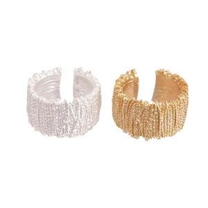 Minimalist geometric open rings with gold and silver lava texture on white background