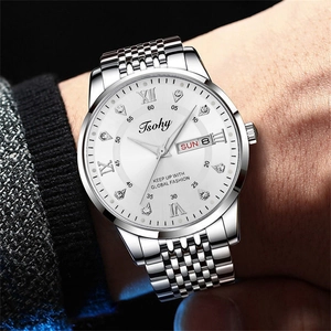 Detailed macro view of the Tsohy silver watch dial with Roman numerals and day-date display