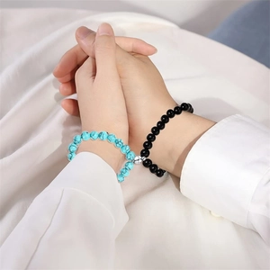 Natural stone couple bracelets with blue and black beads featuring a magnetic heart clasp