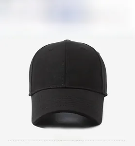 Close-up of black baseball cap featuring brown ELEVEN 3D embroidery and stiff cotton fabric