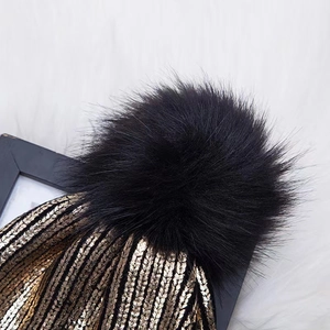 Women's knit beanie with faux fur pom pom and gold metallic thread detailing