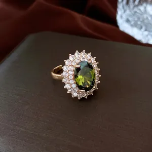 French palace style gold plated oval emerald sunflower ring with white zircon halo