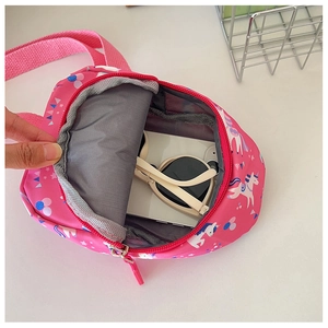 Pink unicorn kids crossbody bag interior showing storage space for phone and sunglasses