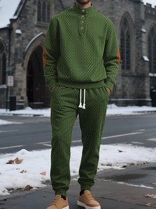 Detail of men's moss green knit set with camel suede elbow patches and stand collar