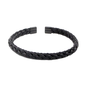Minimalist black stainless steel braided wire open cuff bracelet on white background